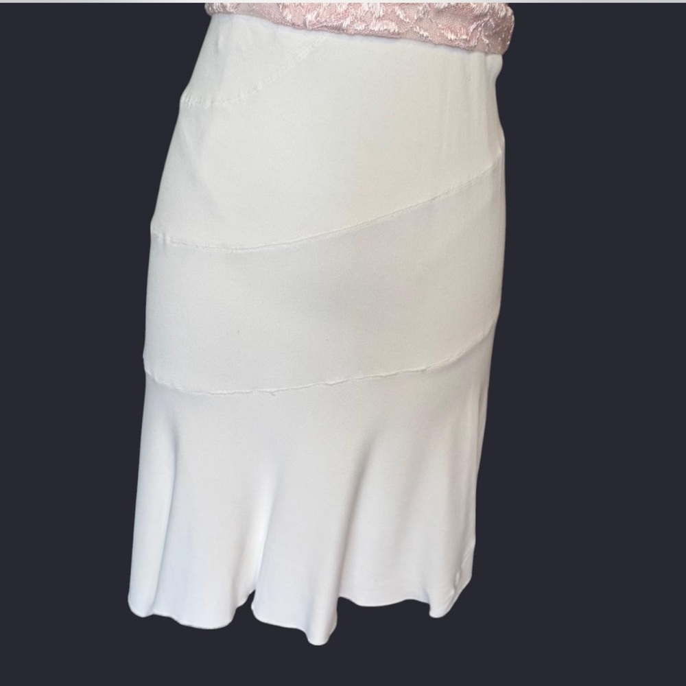 Alaia Cream Asymmetrical Trumpet Skirt for professional or coquette style